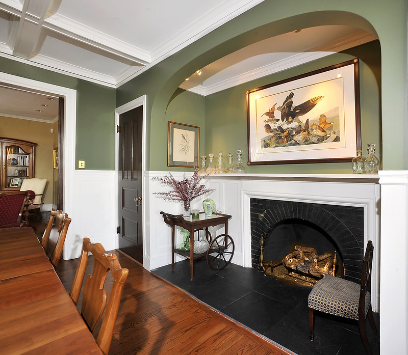 The dining room, one of the Storys’ favorite rooms, has a fireplace in a recessed nook set off by a graceful archway.