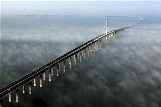 This photo taken Wednesday, June 29, 2011 released by China's Xinhua news agency shows the Jiaozhou Bay Bridge in Qingdao, east China's Shandong Province. China opened Thursday, June 30, 2011, the world's longest cross-sea bridge, which is 42 kilometers (26 miles) long and links China's eastern port city of Qingdao to an offshore island, Huangdao. (AP Photo/Xinhua, Yan Runbo)
