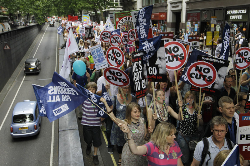 Thousands of public sector workers and teachers march through central London in a one-day strike over planned pension and government cuts. Estimates ranged from at least 100,000 to more than 500,000 joining the strike.