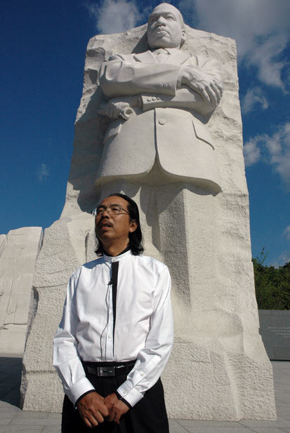 Lei Yixin stands in front of his sculpture of Martin Luther King Jr. in Washington, D.C.