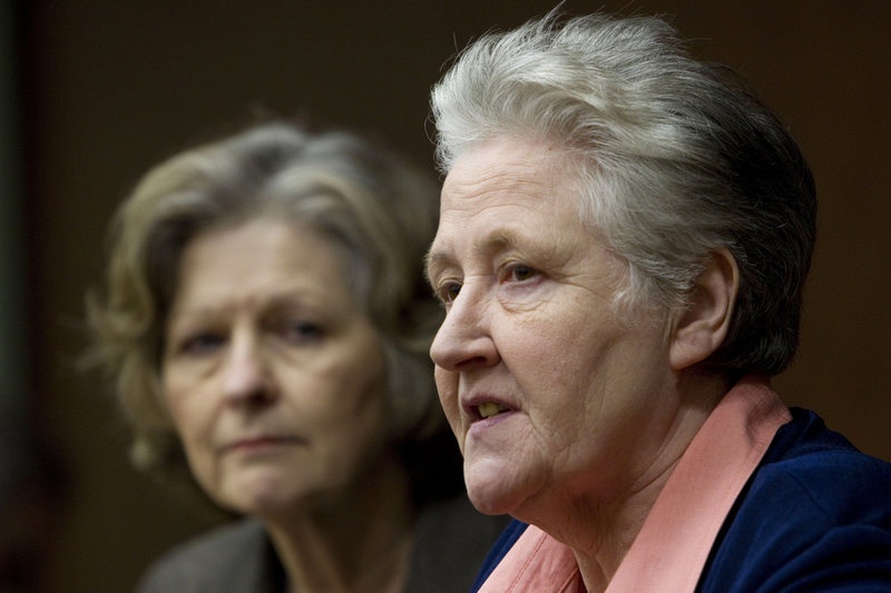 Marie Collins, right, who was assaulted as a 13-year-old by a hospital chaplain, attends a news conference Tuesday at a Vatican-backed symposium on clerical sex abuse in Rome. At left is British psychiatry professor Sheila Hollins.