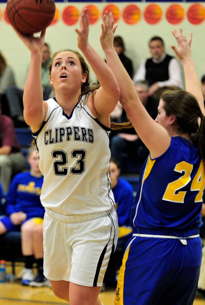 Morgan Cahill of Yarmouth slips past Anna Hickey of Falmouth for a basket. She finished with 22 points.