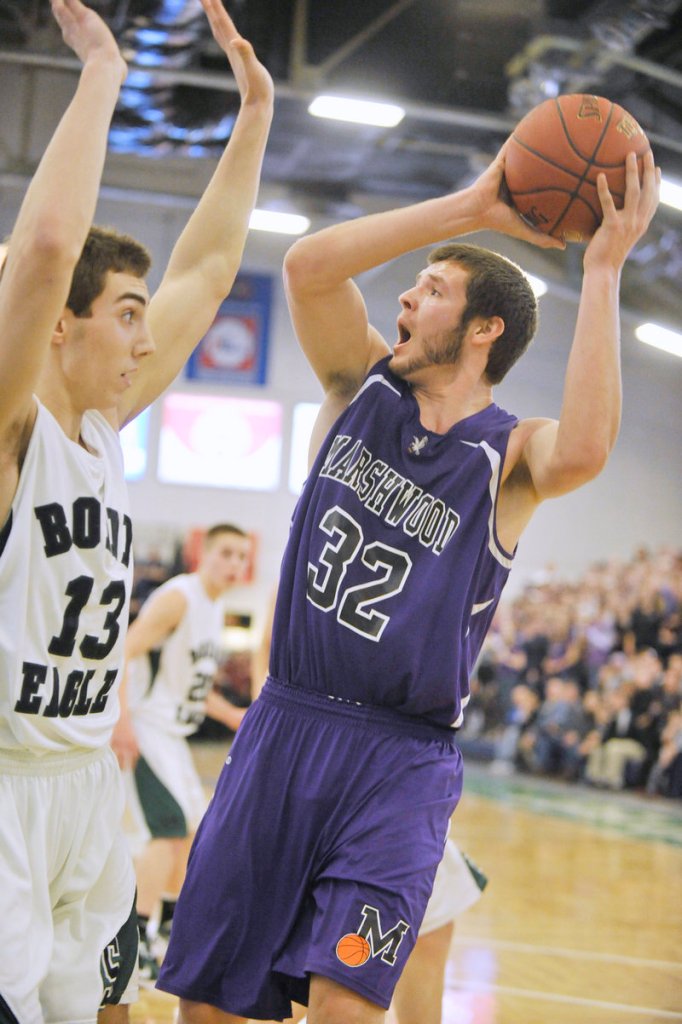 Marshwood's Jack Verrill looks for room to shoot over Bonny Eagle's Cole Libby.