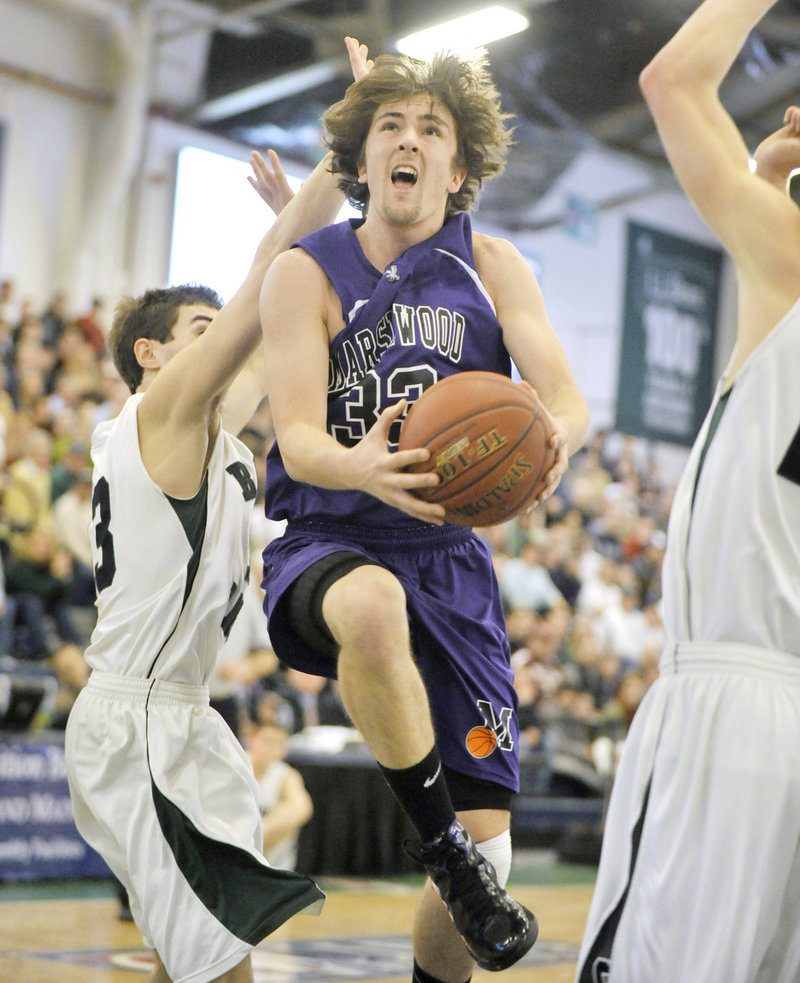 Matthew Crosby of Marshwood drives to the basket past Cole Libby of Bonny Eagle.