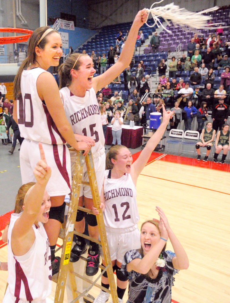 Richmond’s Alyssa Pearson, left, Danica Hurley, Jamie Plummer and Brianna Snedeker and manager Kayla Hurley celebrate after cutting down the net.