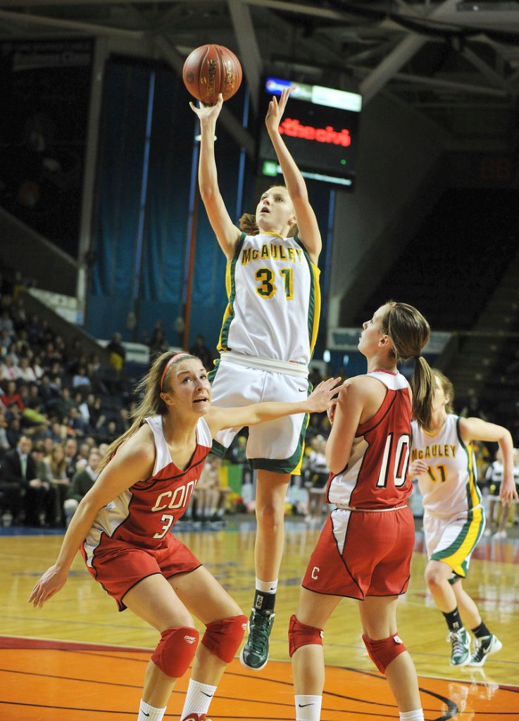 Olivia Smith of McAuley goes up for a shot in Saturday’s Class A state championship game. Smith had 15 points in the Lions’ 54-41 title victory over Cony in Portland.