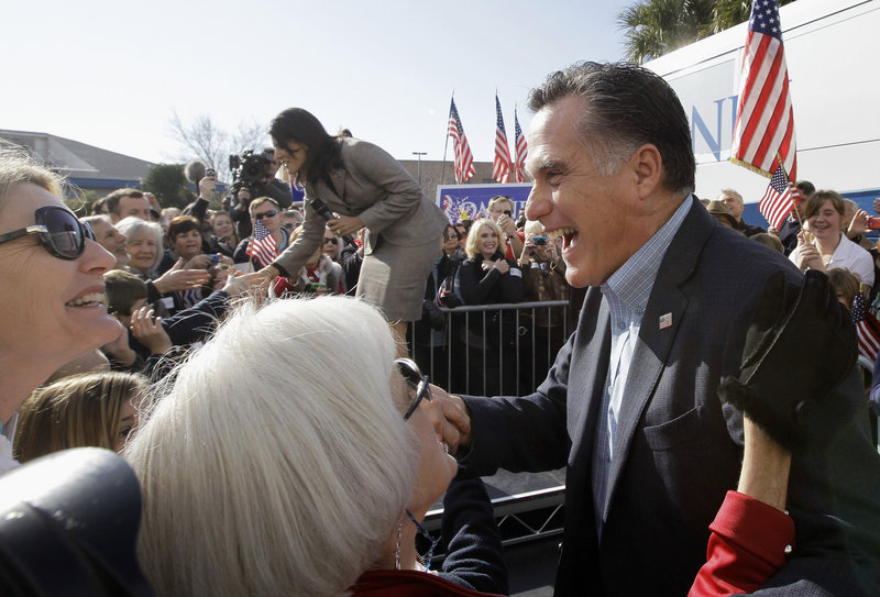 Republican presidential candidate former Massachusetts Gov. Mitt Romney campaigns in Charleston, S.C., in January. Romney faces a tough sell in the Deep South. With Mississippi and Alabama primaries coming up Tuesday, there’s concern voters think he’s too slick.