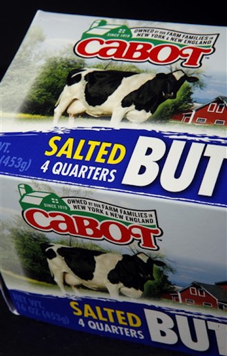 The new Cabot logo is displayed on a package of butter on Tuesday, June 26, 2012 in Montpelier, Vt. Cabot Creamery Cooperative, maker of cheese, butter and other dairy products, is phasing out labels with the state on the logo. A green outline of the state is being dropped in favor of a green barn and the words "Owned by our Farm Families in New York & New England." (AP Photo/Toby Talbot)