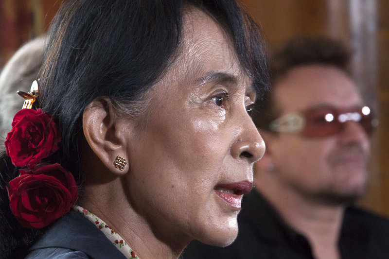 Myanmar’s opposition leader Aung San Suu Kyi, left, speaks during a news conference alongside Irish singer and activist Bono in Oslo on Monday.