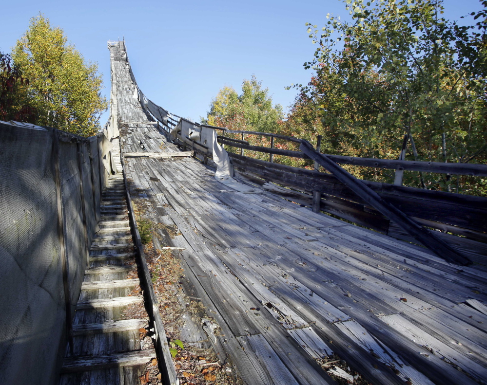 This photo taken Saturday, Sept. 27, 2014 shows the in-run of the Nansen Ski jump in Milan, N.H. The legendary  ski jump for decades lured some of the biggest names in jumping and was host to Olympic tryouts, World Cup competitions and four national championships before its last competition in 1985. Now members of the Nansen Ski Club, local historians and the state Department of Resources and Economic Development are hoping to revive the dilapidated jump and make it a tourist attraction.(AP Photo/Jim Cole)