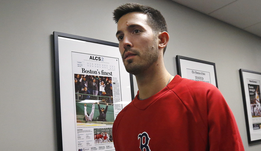 Pitcher Rick Porcello leaves an introductory news conference in Boston on Friday. Porcello recalled his first start in Fenway, which involved a fight with Kevin Youkilis.