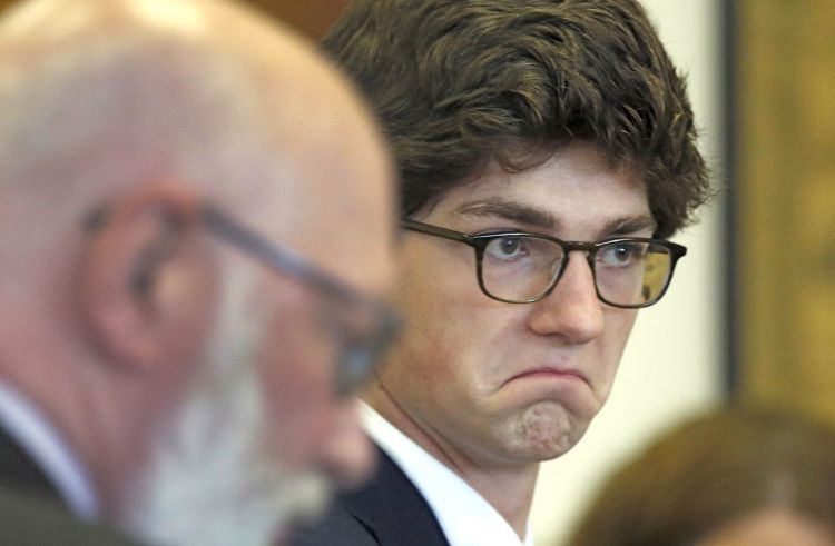 Owen Labrie leaves the Merrimack County Superior courtroom for  lunch after several of his classmates testified Monday in Concord, New Hampshire.  Labrie is charged with raping a 15-year-old freshman in 2014. The Associated Press