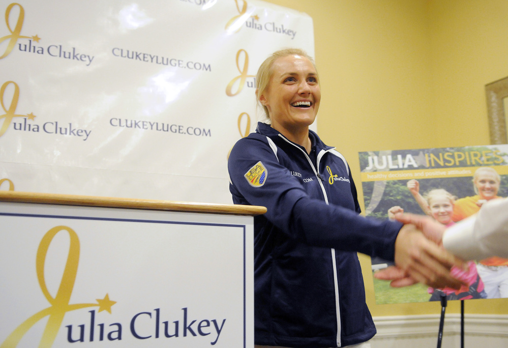 Julia Clukey is congratulated Monday after she announced that she will attempt to earn a spot on the 2018 Olympic Luge Team, during a news conference in Augusta.