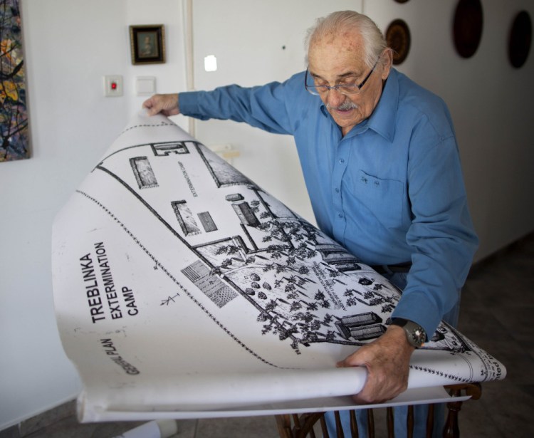 Holocaust survivor Samuel Willenberg displays a Treblinka camp map during a 2010 interview. As more survivors die, historians and educators try to prepare for a world with no personal witnesses to the genocide, often through collected testimonies.
