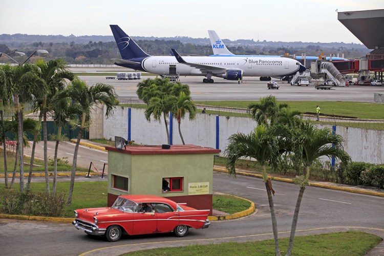 Blue Panorama and KLM aircraft taxi on the runway at Havana's Jose Marti International Airport on Monday. Nearly 160,000 U.S. leisure travelers flew to Cuba last year, along with hundreds of thousands of Cuban-Americans visiting family, mostly on expensive, frequently chaotic charter flights out of Florida.

 Reuters