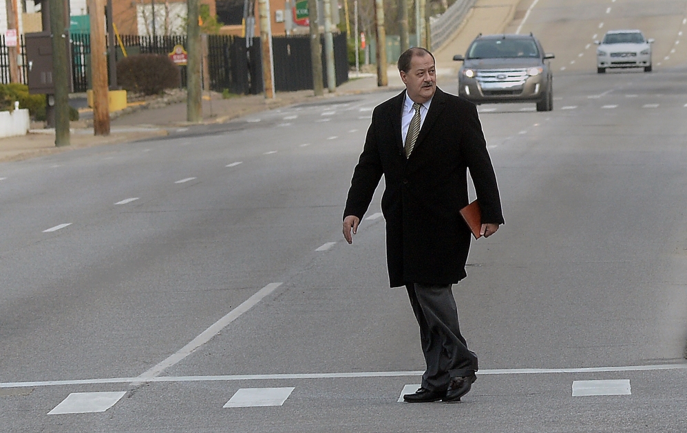 Former Massey Energy CEO Don Blankenship makes his way toward the Robert C. Byrd Federal Courthouse in Charleston, W.V., for his sentencing on Wednesday.