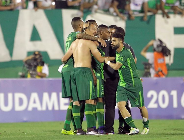 Players of Brazil's Chapecoense team celebrate at the end of a Copa Sudamericana semifinal soccer match against Argentina's San Lorenzo in Chapeco, Brazil, last Wednesday. <em>Associated Press/Andre Penner</em>