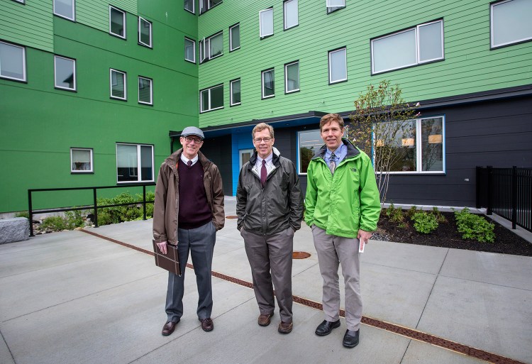 Avesta Housing and Portland Housing Authority unveil a new 45-unit apartment complex on East Oxford Street on Tuesday. Left to right, Mark Adelson, executive director of the housing authority, Dana Totman, CEO/president of Avesta Housing, and Jay Waterman, development director of the housing authority.