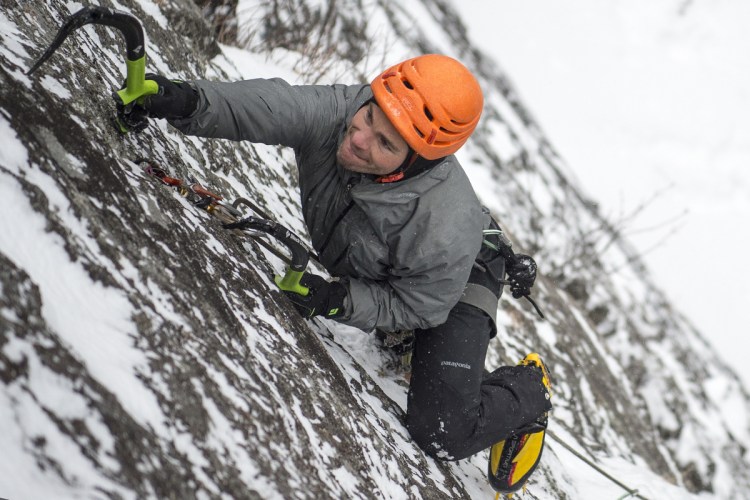 Ryan Howes uses ice tools to climb a cliff at Barrett's Cove in Camden Hills State Park on Jan. 8. The Augusta native has been climbing in Camden for the past 17 years. 