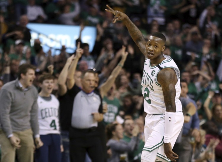 Celtics guard Terry Rozier celebrates his 3-point shot against the Philadelphia 76ers in the first quarter of the Celtics' 117-101 win in Game 1 of their second-round series on Monday in Boston.