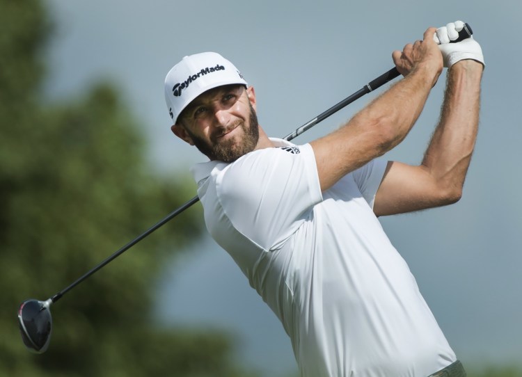 Dustin Johnson hits his tee shot on the 17th hole Saturday at the Canadian Open in Oakville, Ontario Saturday.