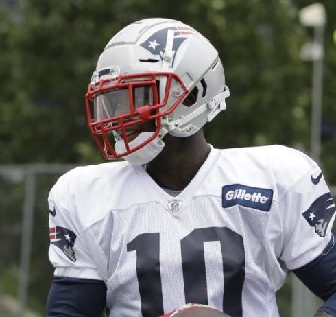 A fan wears a jersey with the name of New England Patriots wide receiver Josh  Gordon as he arrives at Gillette Stadium for an NFL football game between  the Patriots and the