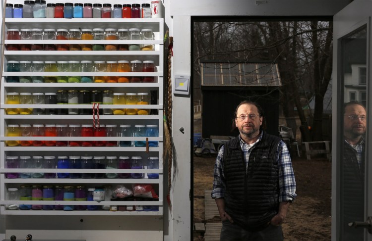 Artist Scott Kelley stands outside his Peaks Island studio last April. Proceeds from Kelley's new book, "I Am Birch," will go to help Wabanaki craftspeople buy raw materials. (Staff photo by Ben McCanna/Staff Photographer).