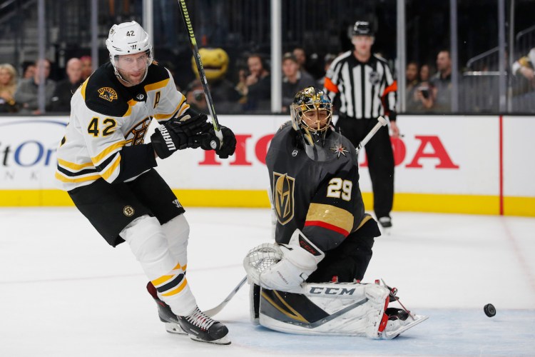 Boston Bruins right wing David Backes (42) scores on Vegas Golden Knights goaltender Marc-Andre Fleury (29) during the shootout on Wednesday.