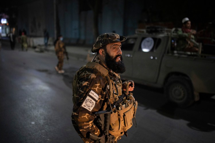 Taliban fighters block roads after an explosion Tuesday, Nov. 2, 2021. An explosion went off Tuesday at the entrance of a military hospital in Kabul, killing severa; people and wounding over a dozen, health officials said.(AP Photo/Ahmad Halabisaz)