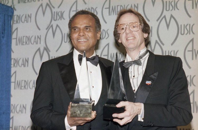 Harry Belafonte and Ken Kragen display the special awards presented to them in Los Angeles in 1986  during the American Music Awards for their efforts in the "USA For Africa" project and the hit song "We Are The World."