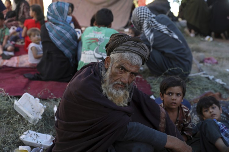 Internally displaced Afghans from northern provinces, who fled their home due to fighting between the Taliban and Afghan security personnel, take refuge in a public park in Kabul on Aug. 9.