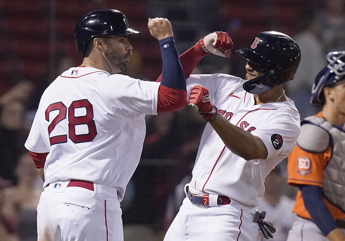 Houston Astros' Chas McCormick, left, and Mauricio Dubon, right, try to get  their gloves on a ball hit by Boston Red Sox's Alex Verdugo in the fourth  inning of a baseball game