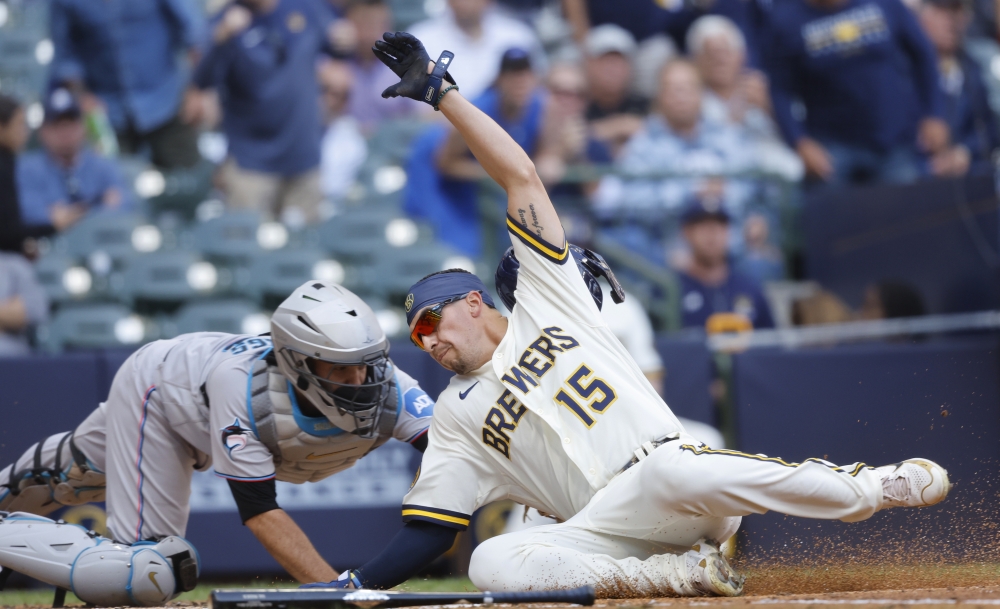 Tag at home plate caps Brewers' 4-3 victory over Pirates